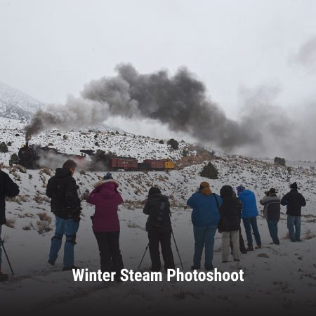 people taking photos of the steam locomotive at the winter steam photoshoot