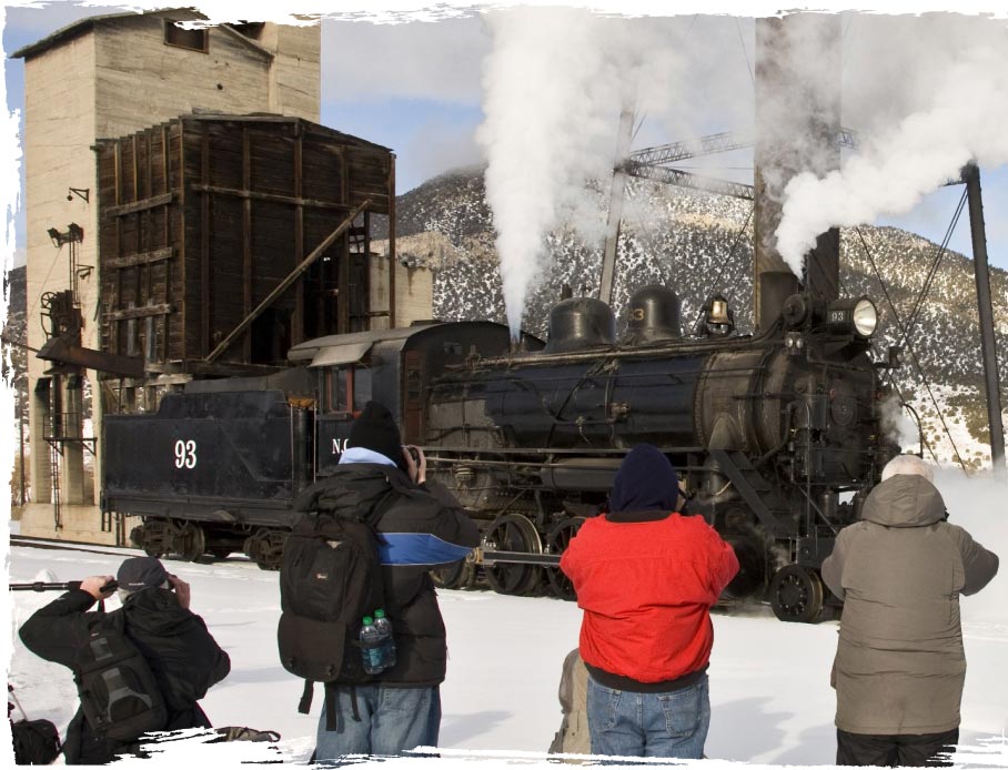 people taking photo of the steam train